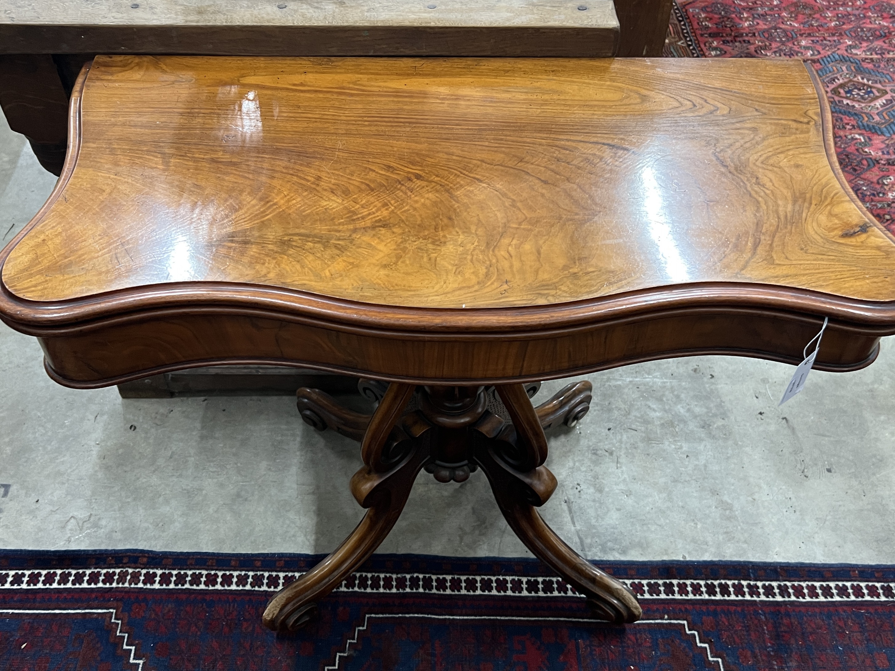 A Victorian mahogany serpentine card table, width 90cm, depth 45cm, height 73cm